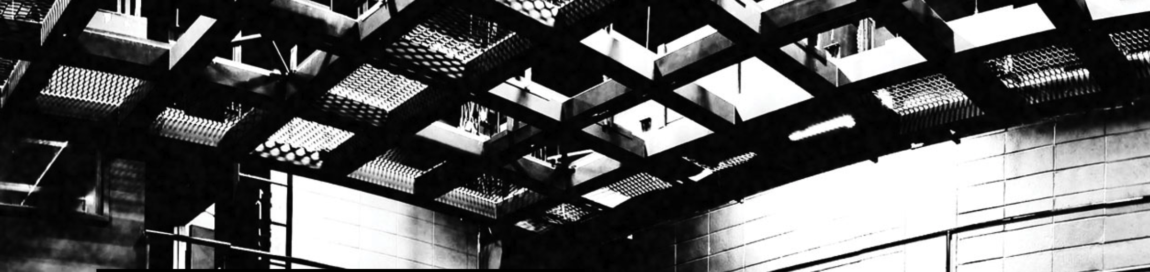 people on stage, chairs near 